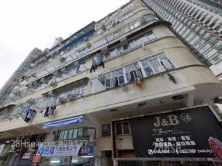 27 Man On Street Building